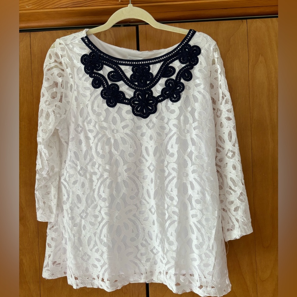Stunning white lace shirt with navy trim
